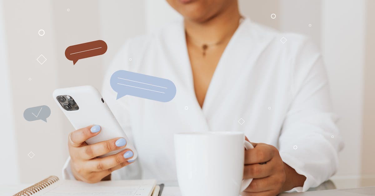 Close-up of a person using a smartphone while holding a coffee cup, showcasing digital communication.