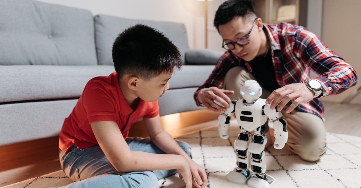A father and son engage with a humanoid robot on a living room carpet, fostering creativity.